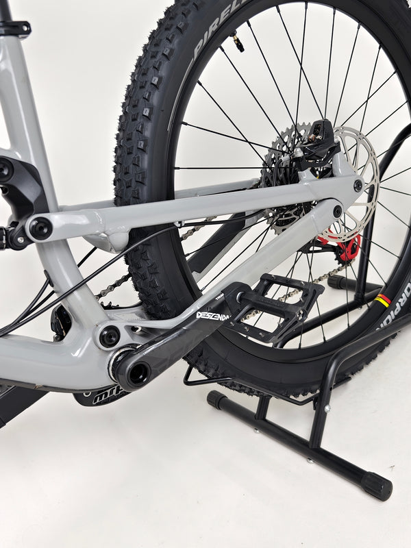 Close-up view of the front wheel of the Nukeproof Mega 275 RS X01 Eagle bike showcasing its braking mechanism.