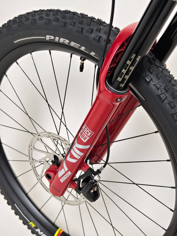 Nukeproof Mega 275 RS X01 Eagle bike focusing on the pedal system and gear alignment.