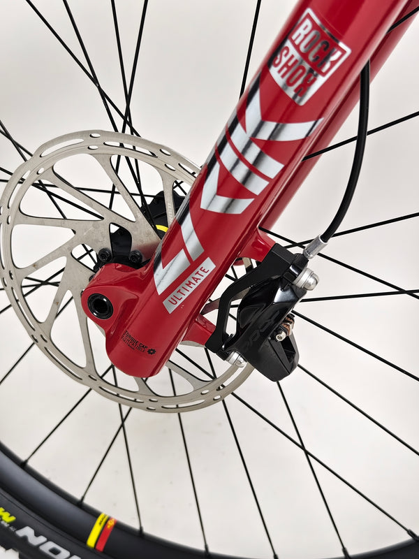 Nukeproof Mega 275 RS X01 Eagle bike showcasing the sturdy crank set and chain alignment.