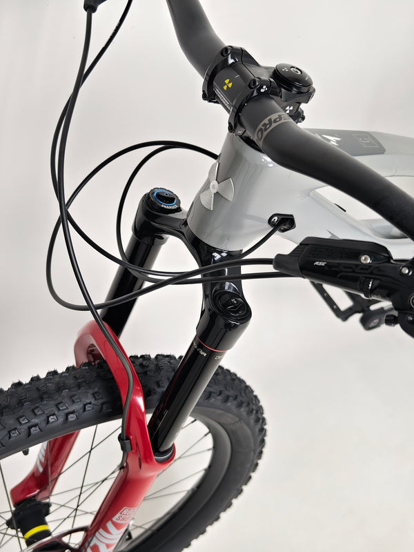 Side angle of the rear end of the Nukeproof Mega 275 RS X01 Eagle bike, focusing on the drive train.