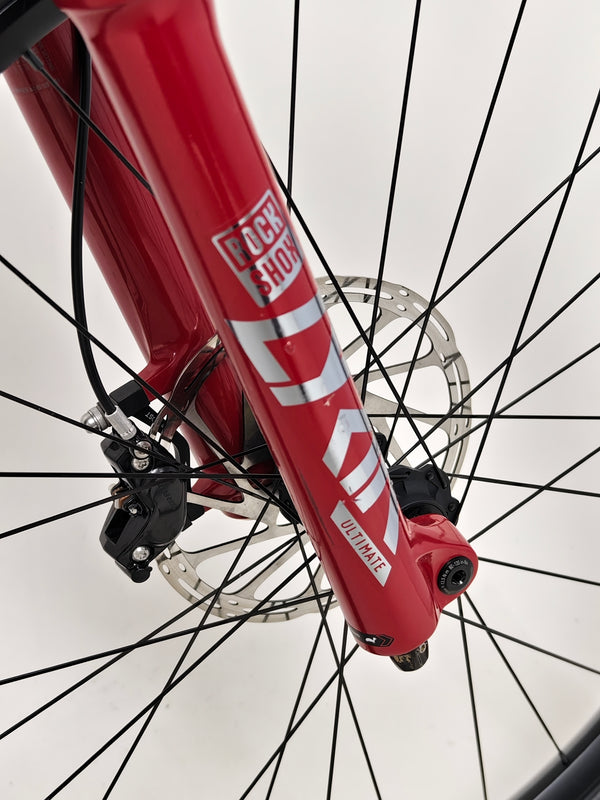 Close-up of the handlebar grips and controls on the Nukeproof Mega 275 RS X01 Eagle bike.