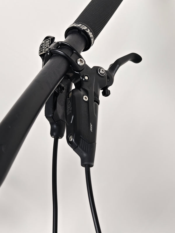 Rear view of the Nukeproof Mega 275 RS X01 Eagle bike displaying the rear gearing and braking system.