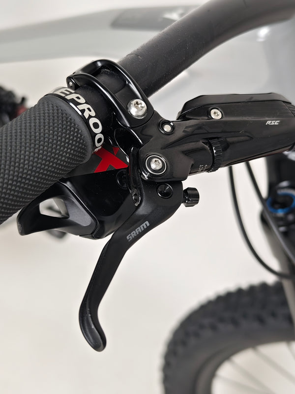 View of the front wheel and tire of the Nukeproof Mega 275 RS X01 Eagle bike, emphasizing traction and stability.