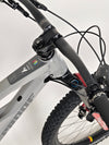 Detail view of the saddle on the Nukeproof Mega 275 RS X01 Eagle bike, emphasizing comfort for long rides.