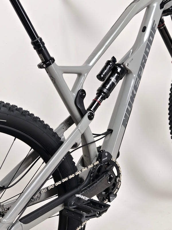 Nukeproof Mega 275 RS X01 Eagle bike showcasing the integrated design of the frame and components.