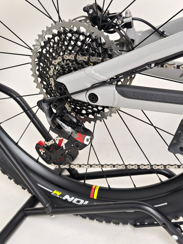 Nukeproof Mega 275 RS X01 Eagle bike displaying the intricate design and engineering of the suspension.