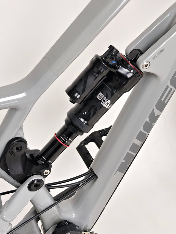 Nukeproof Mega 275 RS X01 Eagle bike showing seat post and saddle from above, detailing the ergonomic design.