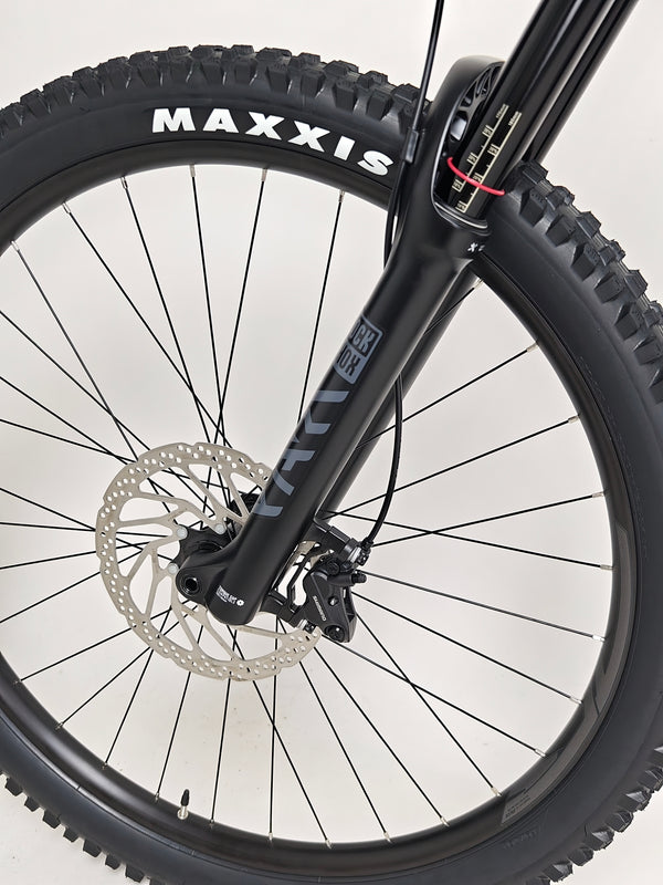 Close-up of the front suspension system on the Merida One-Sixty 500 29 2023 mountain bike.