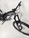 Side view of the Merida One-Sixty 500 29 2023 mountain bike on a display stand.