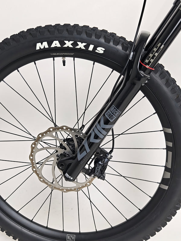 Side view of the Used Ragley Blue Pig Race 2022 mountain bike on a stand emphasizing its overall design, available at eMado Bikes.