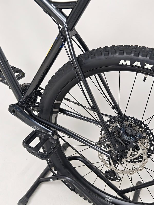 Detailed close-up of the Maxxis tyre on the Used Ragley Blue Pig Race 2022 bike, available at eMado Bikes.