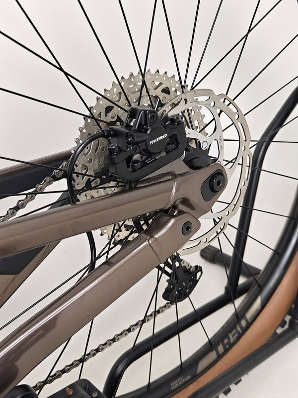 Image of the rear shock and linkage on Rocky Mountain Instinct Alloy 10 2023, highlighting advanced suspension mechanics, available at eMado Bikes.