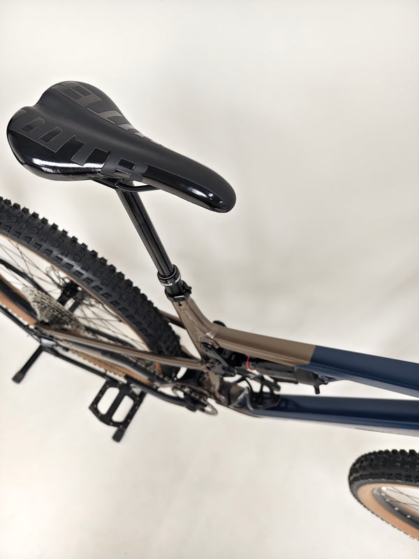 Detailed image of the brake system on the Rocky Mountain Instinct Alloy 10 2023, highlighting Tektro components, available at eMado Bikes.