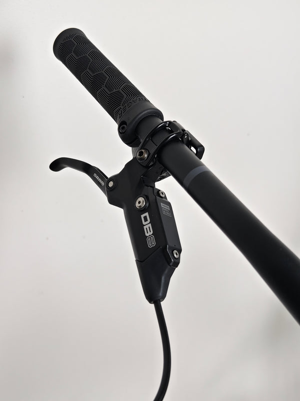 Trek Top Fuel 8 GX AXS 2024 LARGE Frame in Excellent Condition at eMado Bikes, emphasizing the suspension system with a close perspective.