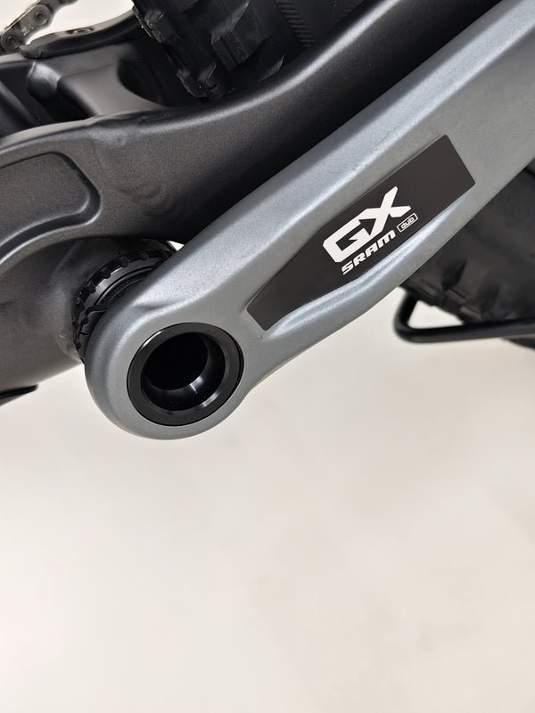 Highlighting the Trek Top Fuel 8 GX AXS 2024 LARGE Frame in Excellent Condition at eMado Bikes in a biking community setting.