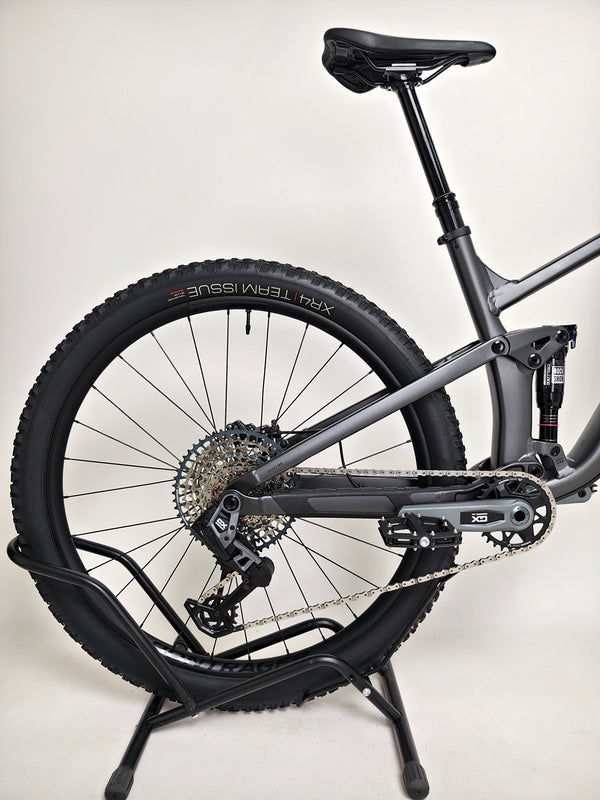 Trek Top Fuel 8 GX AXS 2024 LARGE Frame in Excellent Condition at eMado Bikes, showcasing a side view with detailed brake system.