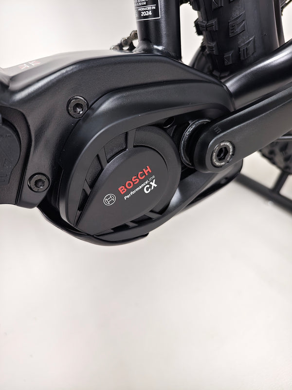 The front of the Whyte e-505 v1 Electric Bike 2024 in XL, showcasing its headtube and hydroformed frame highlights.