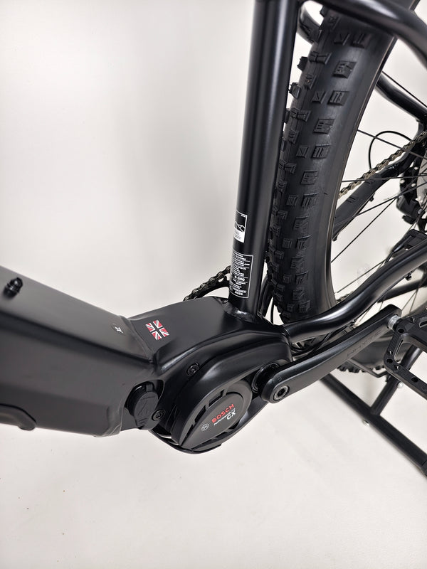 Full view of the Whyte e-505 v1 Electric Bike 2024 parked, highlighting perfect paint and minimal wear.