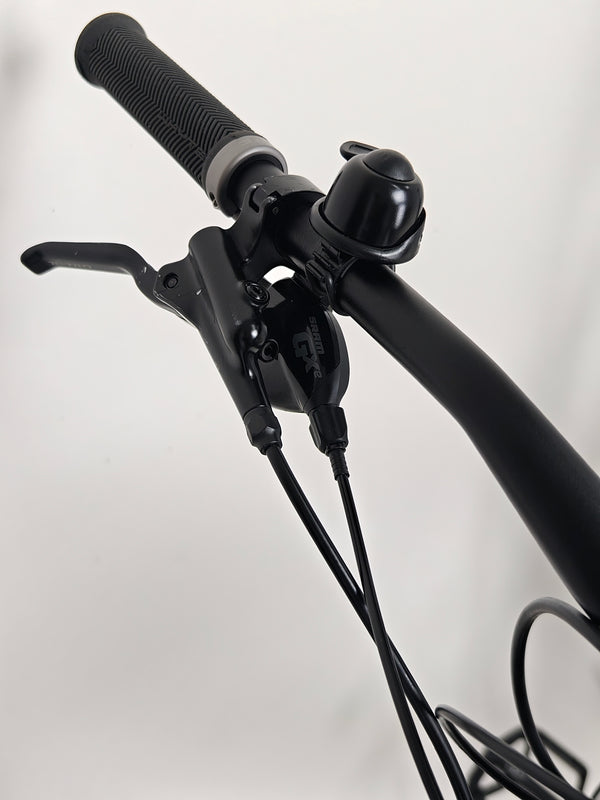 Whyte e-505 v1 Electric Bike 2024 view from the back, highlighting the rear derailleur setup and tyre profile.