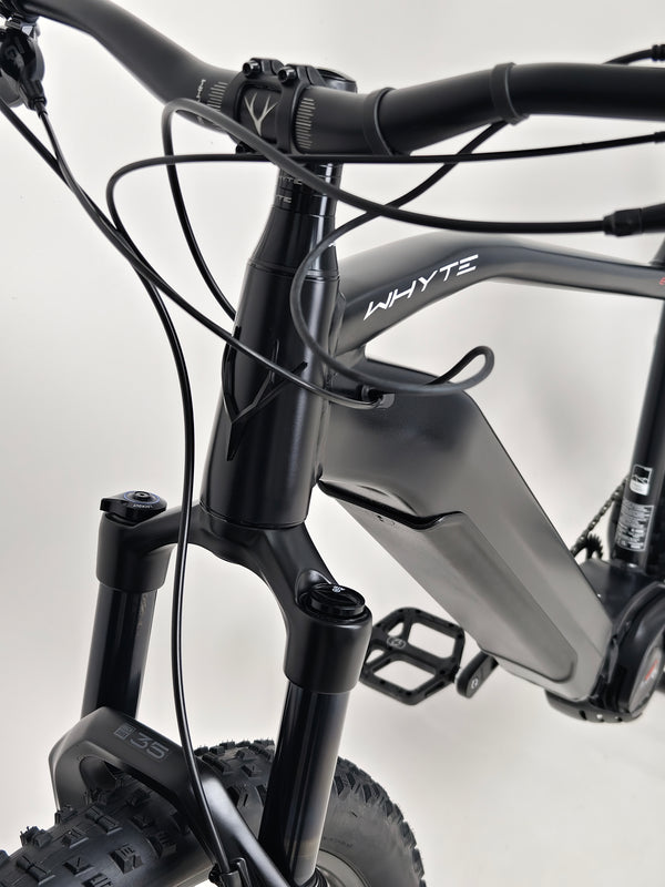 The Whyte e-505 v1 Electric Bike 2024 positioned against a scenic backdrop, showing off its visual appeal and functionality.