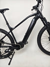 Whyte e-505 v1 Electric Bike 2024 positioned outdoors, showcasing its low mileage and like-new state.