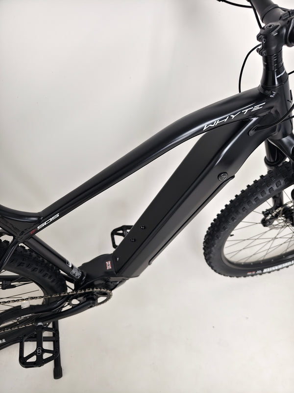 Detailed view of the Whyte e-505 v1 Electric Bike's powerful Bosch Performance Line CX motor and removable battery.