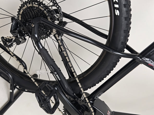 Whyte e-505 v1 Electric Bike 2024 in XL, emphasizing its robust tyres designed for versatile terrain.