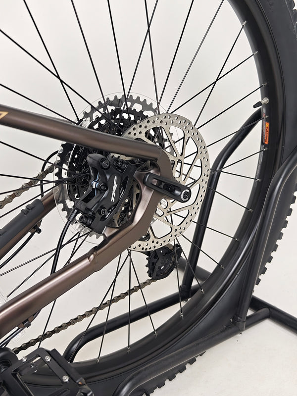 Image of the Whyte 901 V5 2024 Mountain Bike in an action pose at eMado.