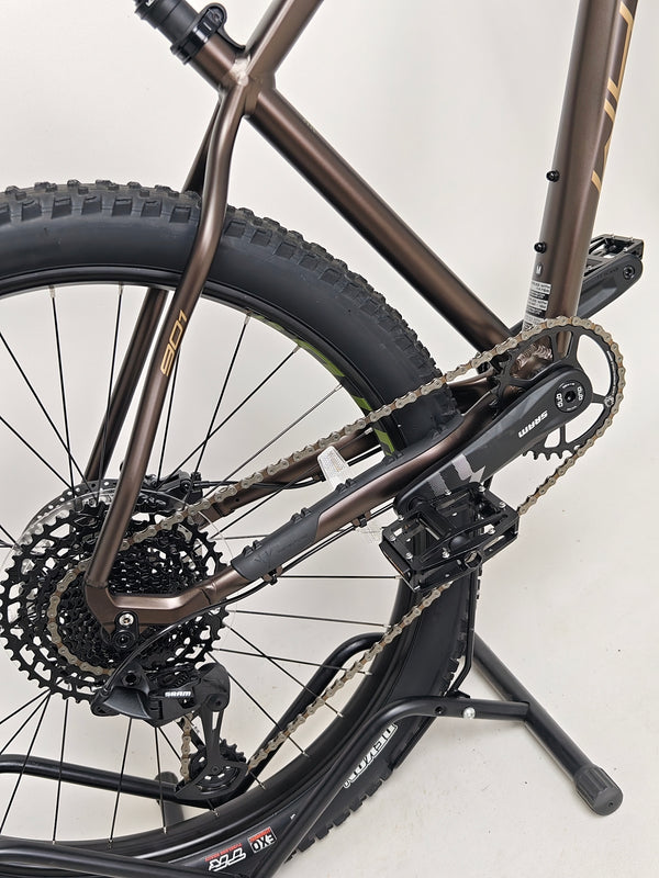 Close-up view of the rear hub and axle on the Whyte 901 V5 2024 Mountain Bike at eMado.