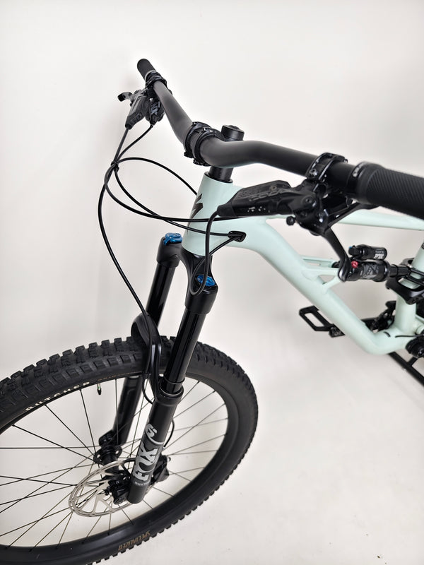 Specialized Status 160 in Very Good Condition at eMado Bikes - showing the bike set against a scenic backdrop.