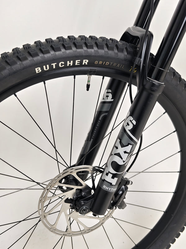 Specialized Status 160 in Very Good Condition at eMado Bikes - dynamic action shot of the bike on a trail.