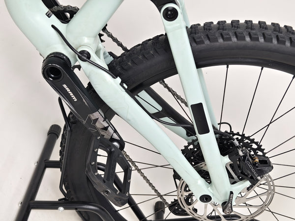 Specialized Status 160 in Very Good Condition at eMado Bikes - showcasing the bike among nature settings.