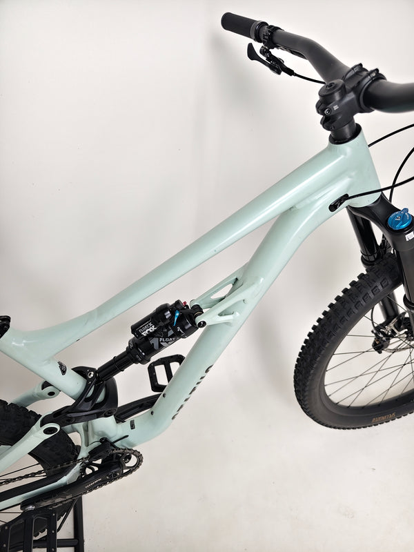 Specialized Status 160 in Very Good Condition at eMado Bikes - profile view of the bike during a sunset.