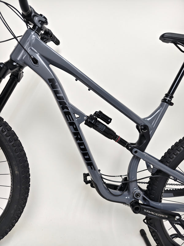 Wide shot of Nukeproof Mega 290 Alloy Comp 2023 bike in excellent condition available at eMado Bikes.