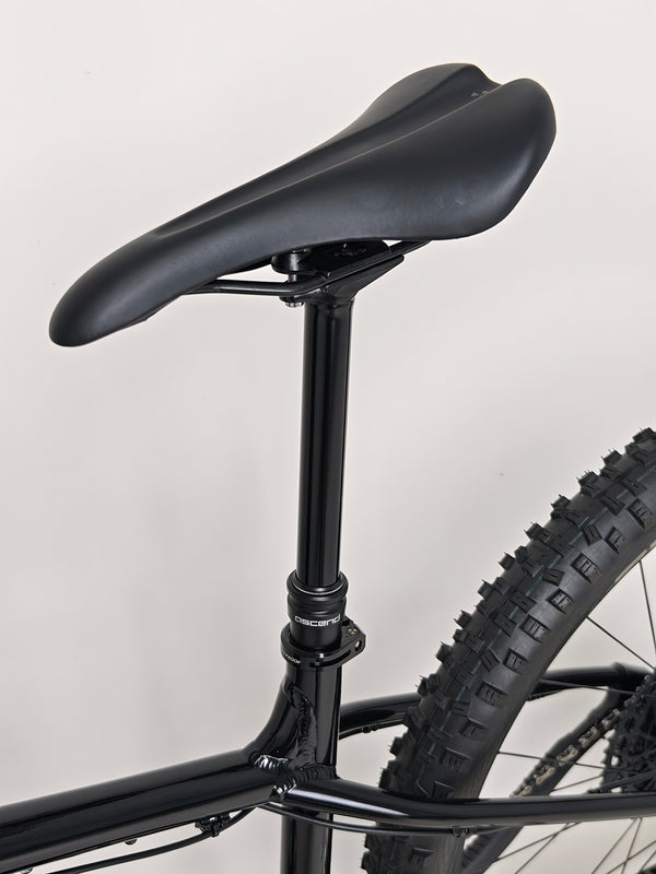 The rear triangle view of Nukeproof Scout 275 RS 2023 in excellent used condition, focused on wheel setup.