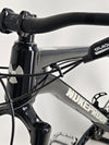 Close-up of the handlebars on the Nukeproof Scout 275 RS 2023 in excellent used condition, including the controls.