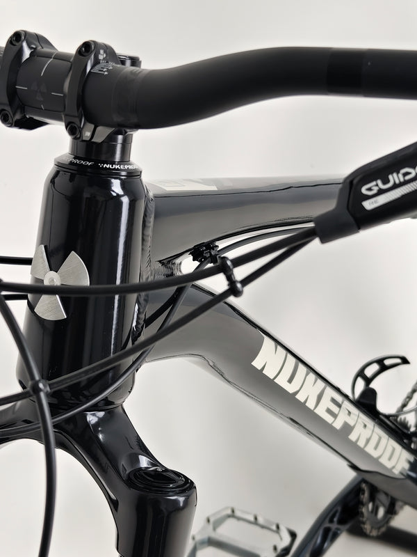 Close-up of the handlebars on the Nukeproof Scout 275 RS 2023 in excellent used condition, including the controls.