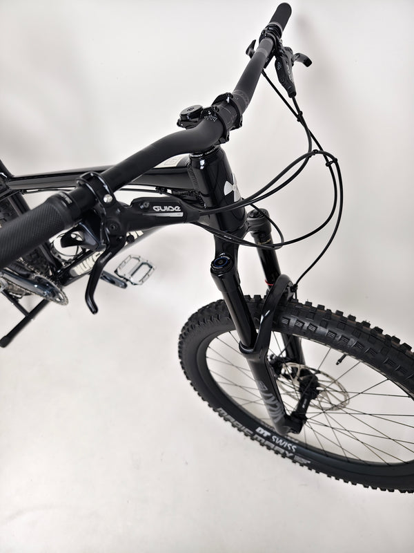 Beautiful landscape background featuring Nukeproof Scout 275 RS 2023 in excellent used condition, ready for trails.