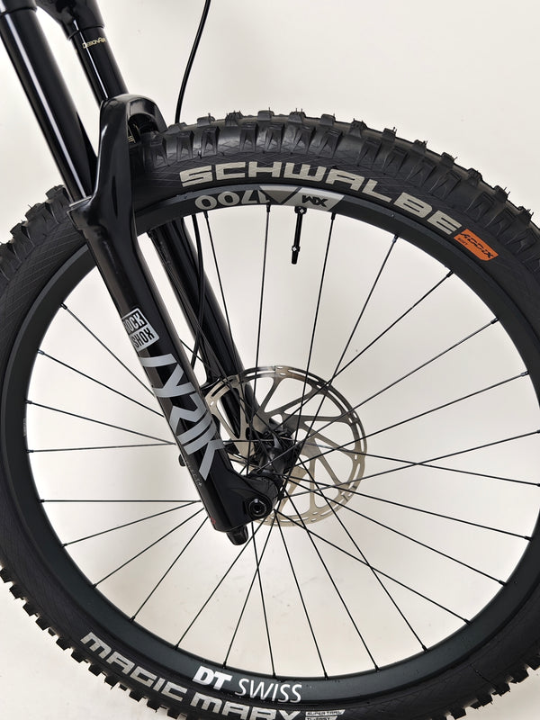 Creative angle of Nukeproof Scout 275 RS 2023 in excellent used condition, displaying it's rugged capability.