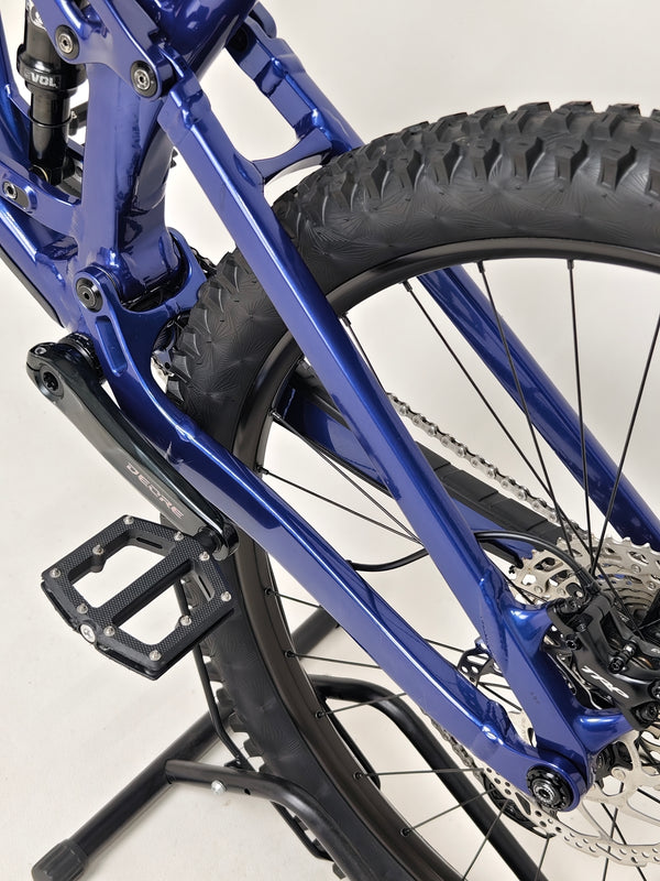 Trek Fuel EX 7 2024 Gen 6 (upgraded), M-L in Very Good Condition - showcasing the disc brakes under action.