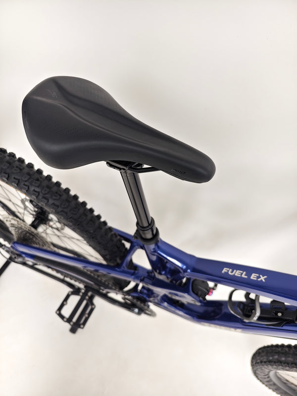 Trek Fuel EX 7 2024 Gen 6 (upgraded), M-L in Very Good Condition - showcasing the bike's suspension travel.