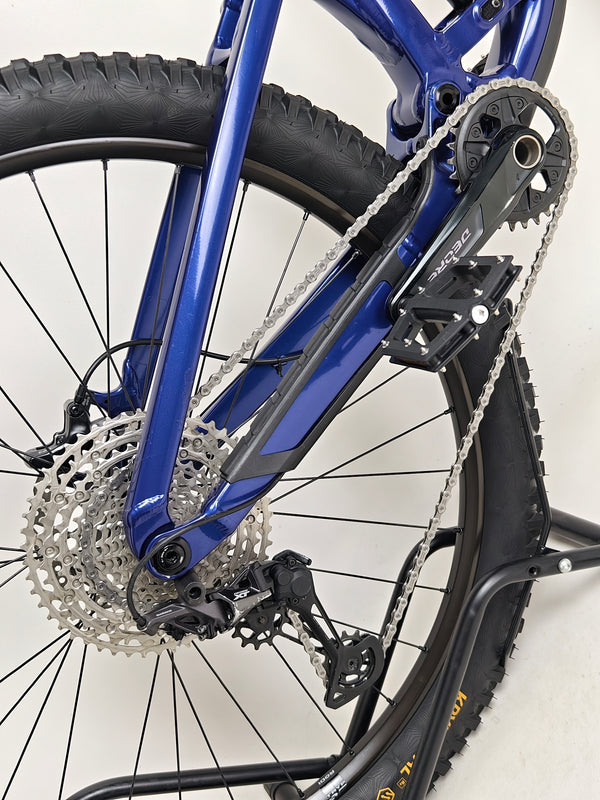 Trek Fuel EX 7 2024 Gen 6 (upgraded), M-L in Very Good Condition - flat lay image of the bike on a trail.