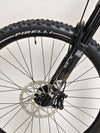 Action image of the Transition Smuggler NX 2024 in medium as it rides off-trail, displaying its capability.