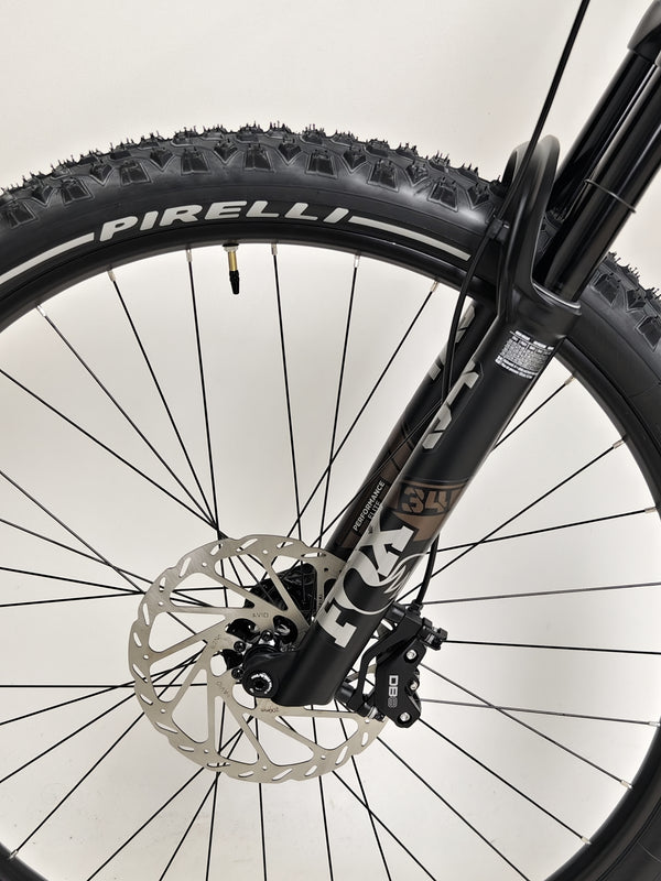 Action image of the Transition Smuggler NX 2024 in medium as it rides off-trail, displaying its capability.