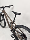 View of the bike tires and wheels on the Transition Smuggler NX 2024 in medium for outdoor performance.