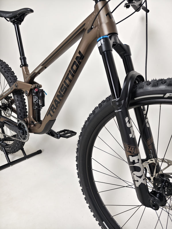 Action shot of the Transition Smuggler NX 2024 in medium, perfect for mountain biking adventures.