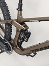 Side profile of the Transition Smuggler NX 2024 in medium in an outdoor setting, highlighting off-road capabilities.