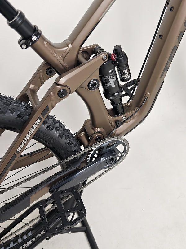 Angle view demonstrating the 29-inch wheels on the Transition Smuggler NX 2024 in medium, ideal for tackling trails.