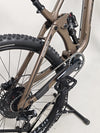 View of the bike's suspension system on the Transition Smuggler NX 2024 in medium, essential for performance.