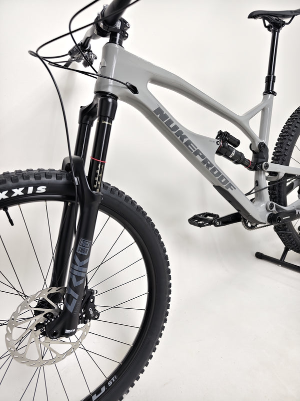 Nukeproof Mega 290 CARBON - Side profile showcasing the bike's sleek design and upgraded components.